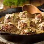 Close-up of Amish hamburger steak bake in skillet