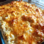 A close-up of a bubbly Lazy Day Creamy Chicken & Rice Casserole topped with melted golden cheese.