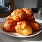 A pile of golden-brown, fluffy Uštipci, perfect for a delicious Balkan Breakfast.