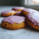 Close-up of several delicious lavender matcha cookies topped with a vibrant purple icing.