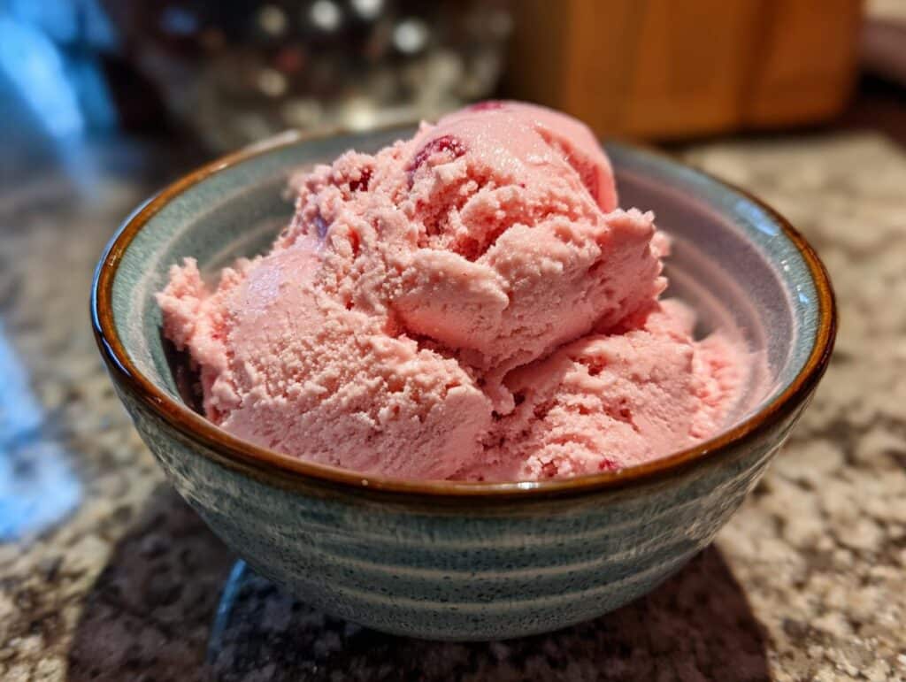 Close-up of a bowl filled with creamy, homemade Strawberry Banana Ice Cream.
