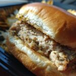 Close-up of a juicy turkey burger on a bun, showcasing one of our delicious ground turkey recipes.