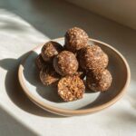 A plate of delicious homemade protein balls, perfect for a healthy snack.