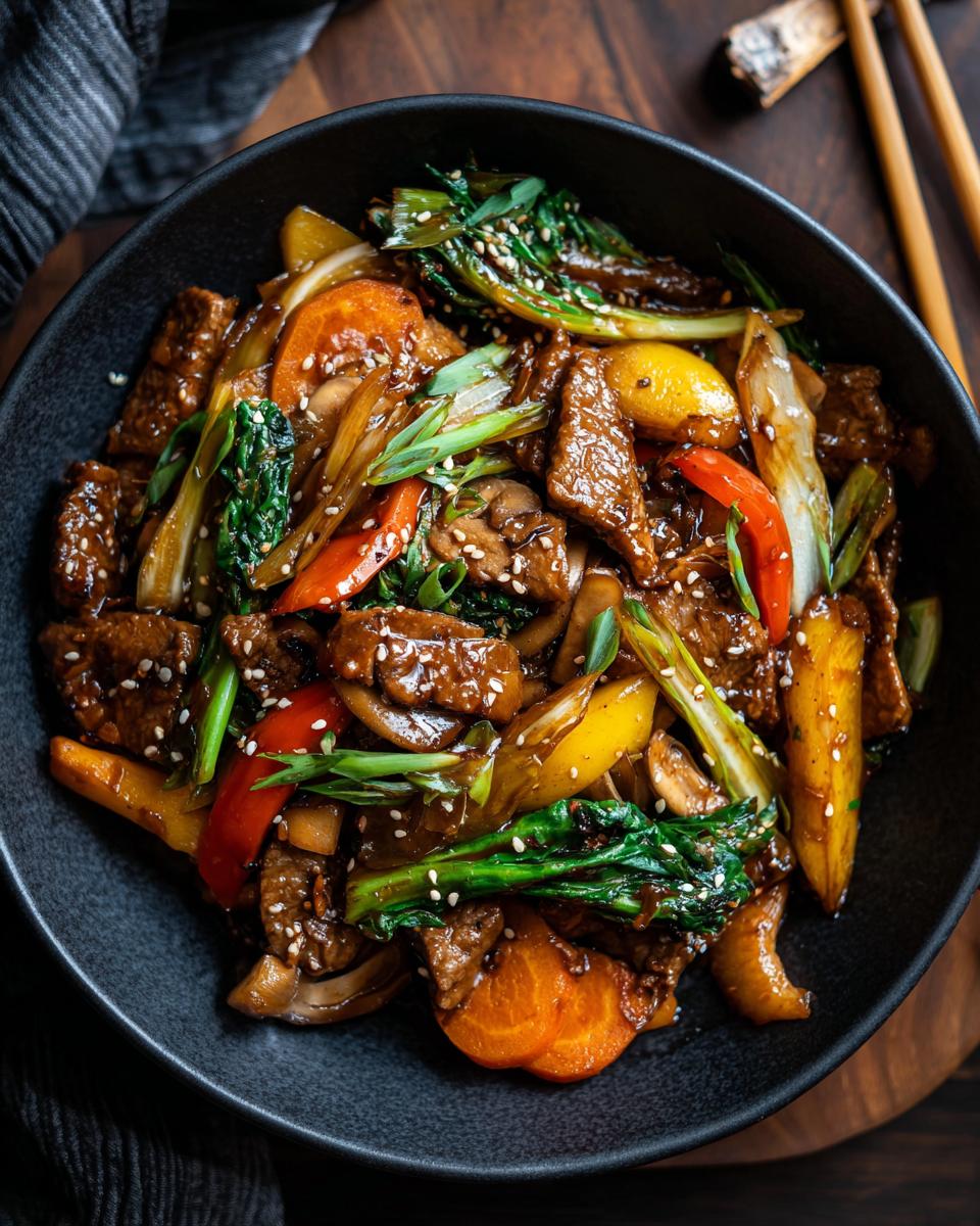 A flavorful Broccoli Mushroom Stir Fry with colorful vegetables and sesame seeds served in a black bowl.