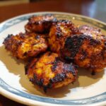 A plate of freshly cooked Chick Fil Grilled Nuggets, showing their golden-brown color and grill marks.