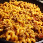 Close-up of Chili Mac Quick Weeknight Dinner with macaroni, chili, and melted cheese.