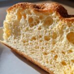 Close-up of a slice of airy Cloud Bread, showing its light and porous texture.