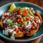 A vibrant Cottage Cheese Taco Bowl with fresh toppings like pico de gallo, cilantro, and a lime wedge.