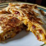 Close-up of Crispy Air Fryer Chicken Mozzarella Wraps, showing the crunchy outside and melty cheese inside.