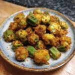 A plate piled high with golden brown Crispy Southern Fried Okra, ready to be enjoyed.