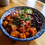 A vibrant Quick & Easy Healthy Sweet Potato Taco Bowl with black beans, guacamole, and fresh toppings.