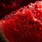 Close-up of a juicy watermelon slice, showing the texture and bubbles, perfect for The Watermelon Juice recipe.